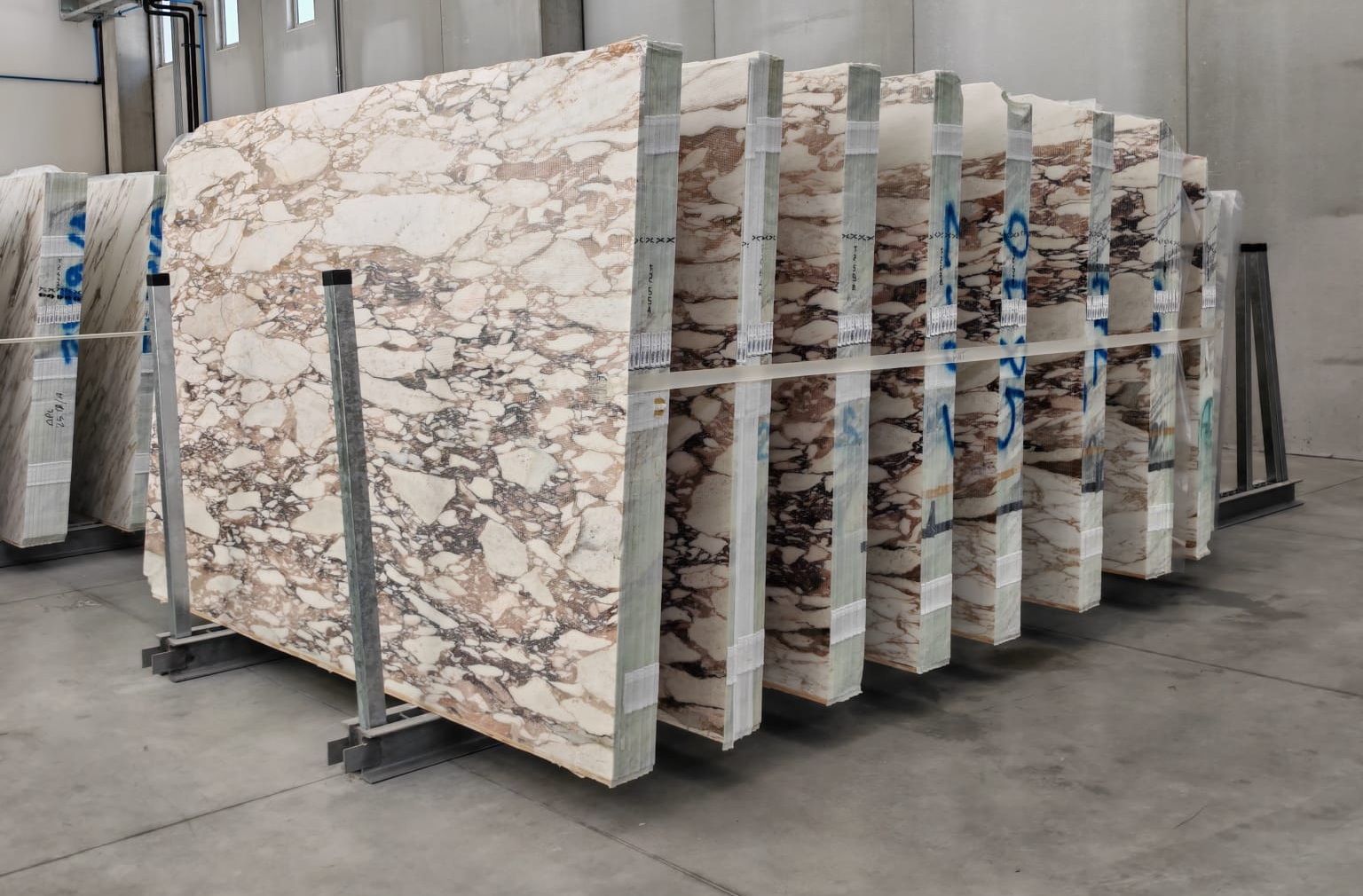 Calacatta Viola marble: white background with dramatic purple and grey veining — rare and distinctive
